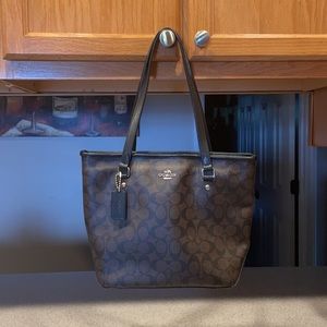 Coach purse 9x12”. Classic brown and black pattern